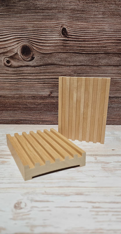 Two wooden coasters on a wooden surface with a rustic background