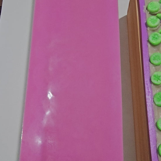 Video removing impression mat from the soap loaf and showing other soap loaves.