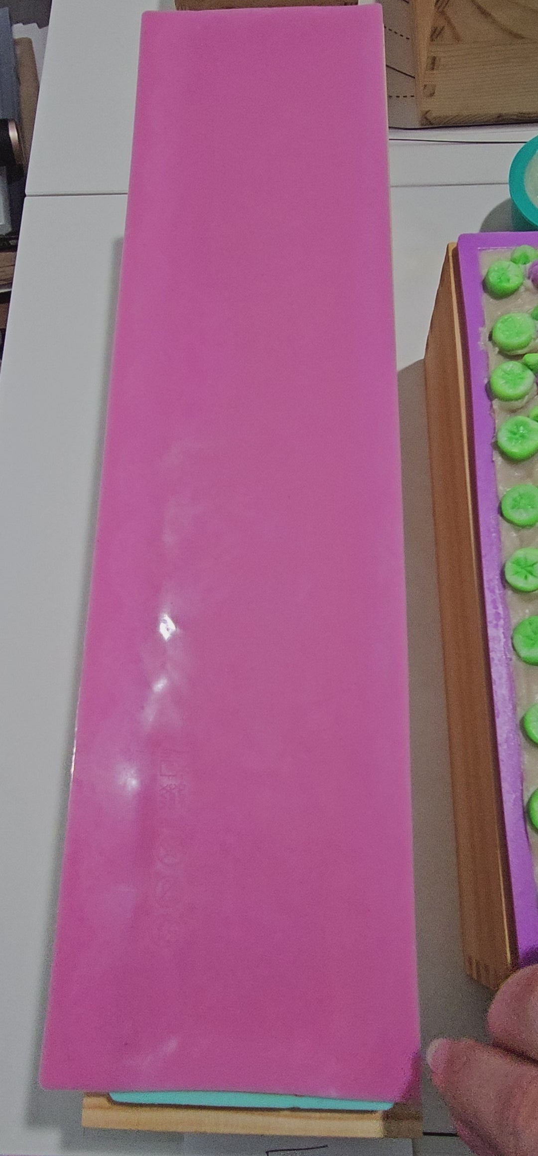 Video removing impression mat from the soap loaf and showing other soap loaves.